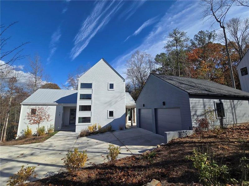 Front exterior of a new home in Aster, Roswell, GA, highlighting curb appeal (Image 1). Front exterior of a new home in Aster, Roswell, GA, highlighting curb appeal (Image 1).