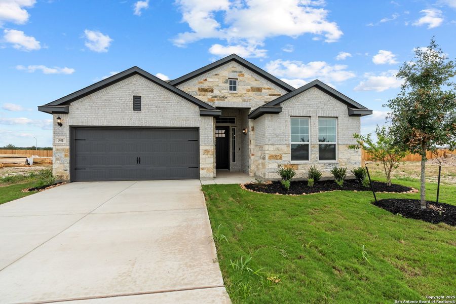 Front exterior of a new home in Alsatian Oaks, Castroville, TX, highlighting curb appeal (Image 1). Front exterior of a new home in Alsatian Oaks, Castroville, TX, highlighting curb appeal (Image 1).
