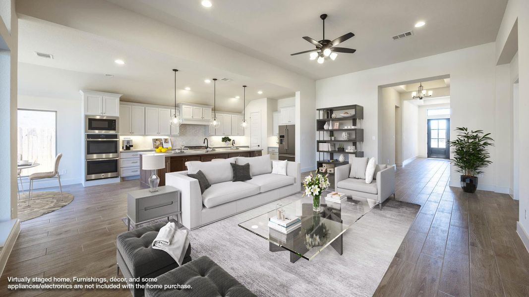 Living area with recessed lighting, dark wood-type flooring, a ceiling fan, and a chandelier
