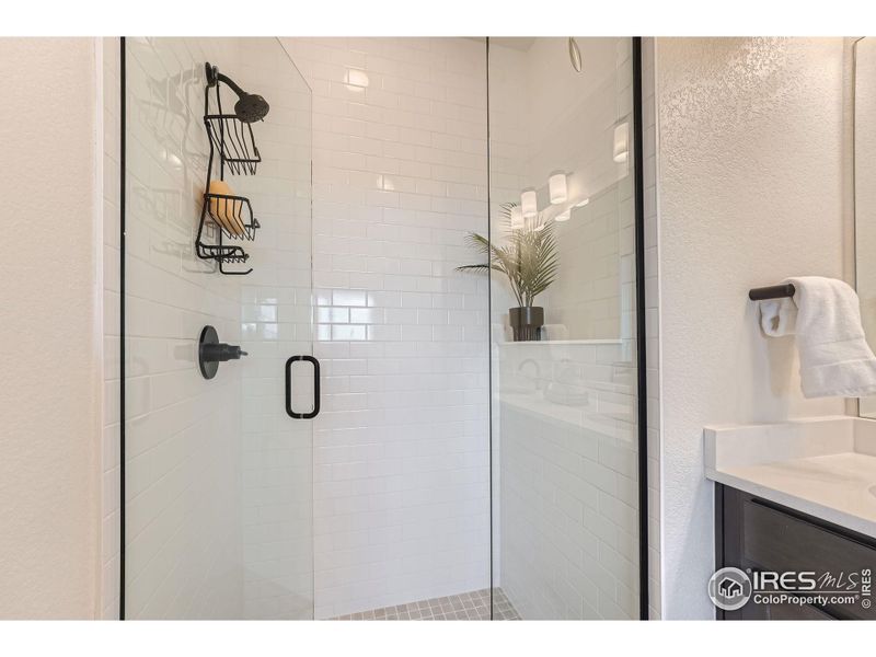 Clear glass and a clean stand-up shower.