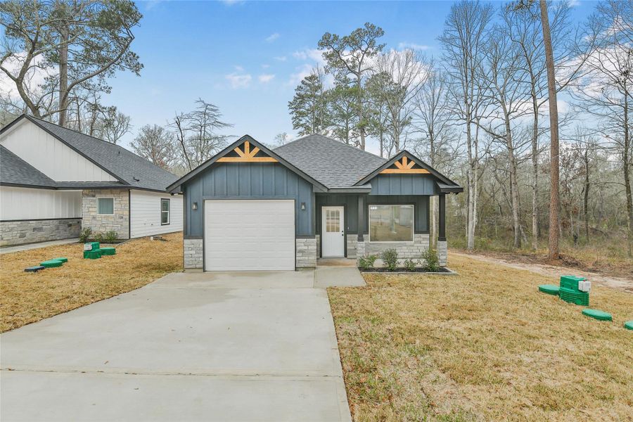 Front exterior of a new home in , Willis, TX, highlighting curb appeal (Image 25).