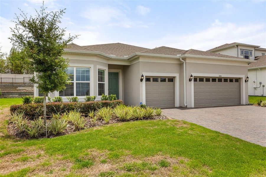 Front exterior of a new home in , Winter Garden, FL, highlighting curb appeal (Image 22).