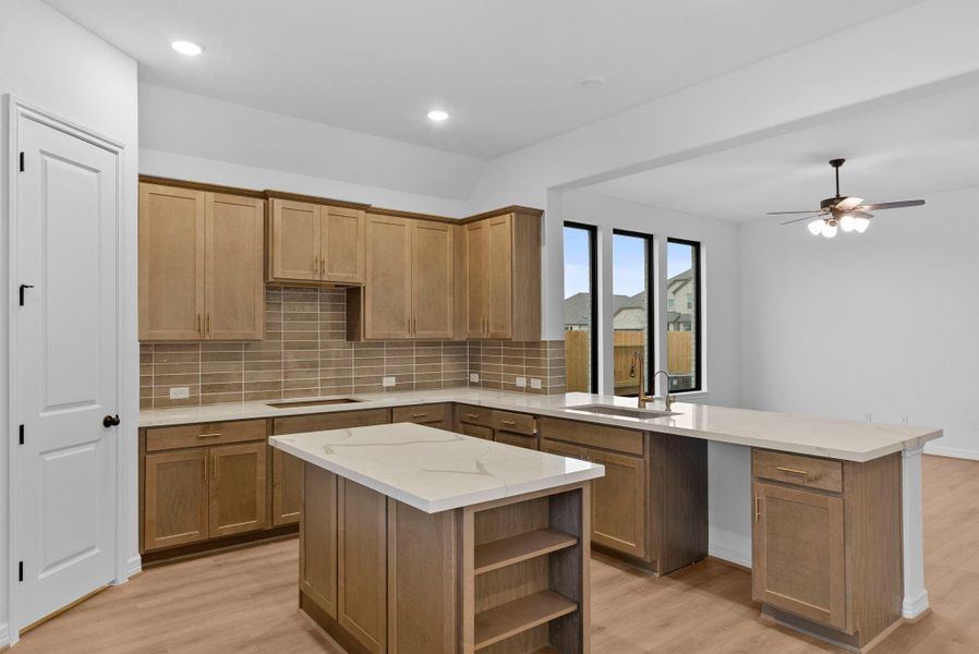 Open-concept kitchen flowing seamlessly into the family room—perfect for entertaining and everyday living.