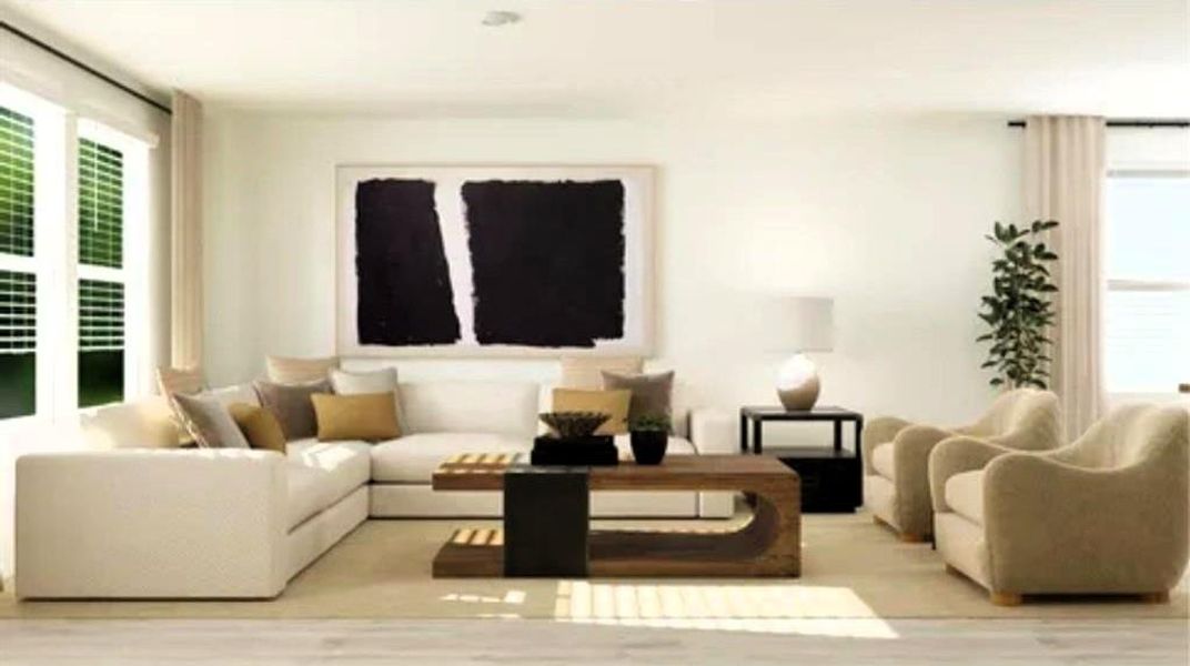 Living room with plenty of natural light and wood finished floors