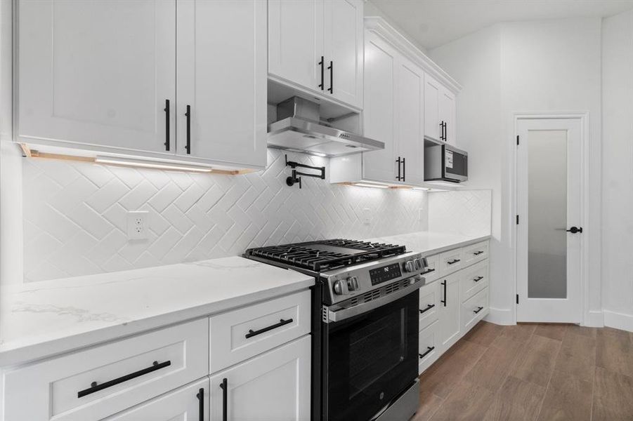 Large open kitchen with pot filler and soft close drawers