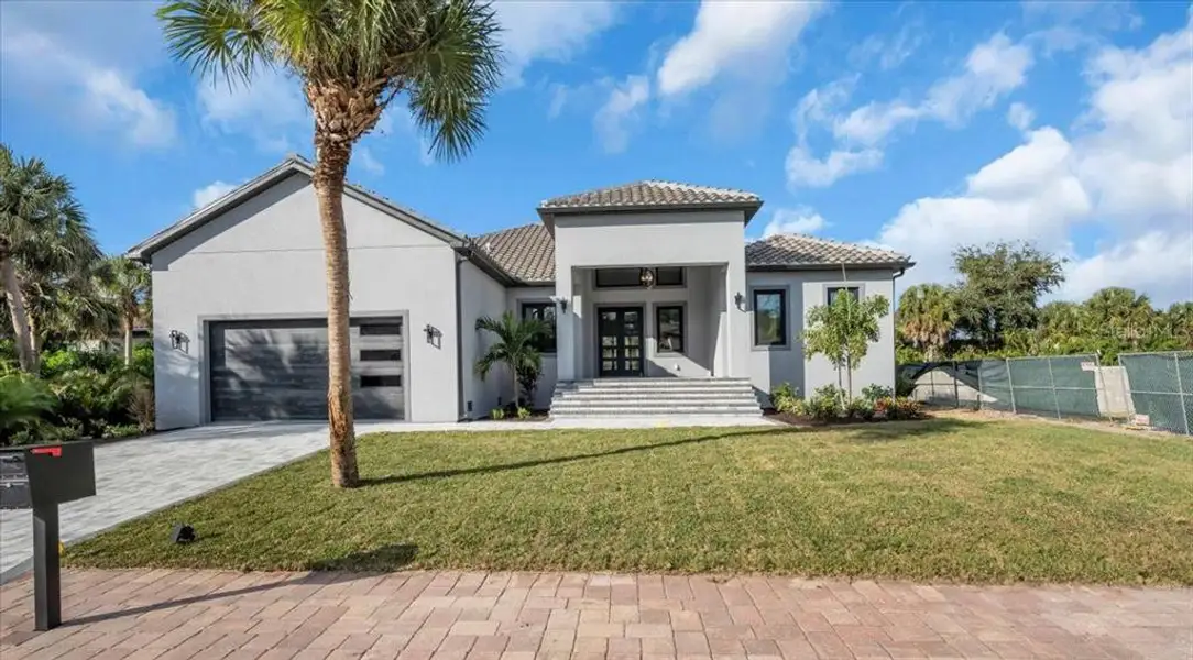Front exterior of a new home in , Nokomis, FL, highlighting curb appeal (Image 2). Front exterior of a new home in , Nokomis, FL, highlighting curb appeal (Image 2).