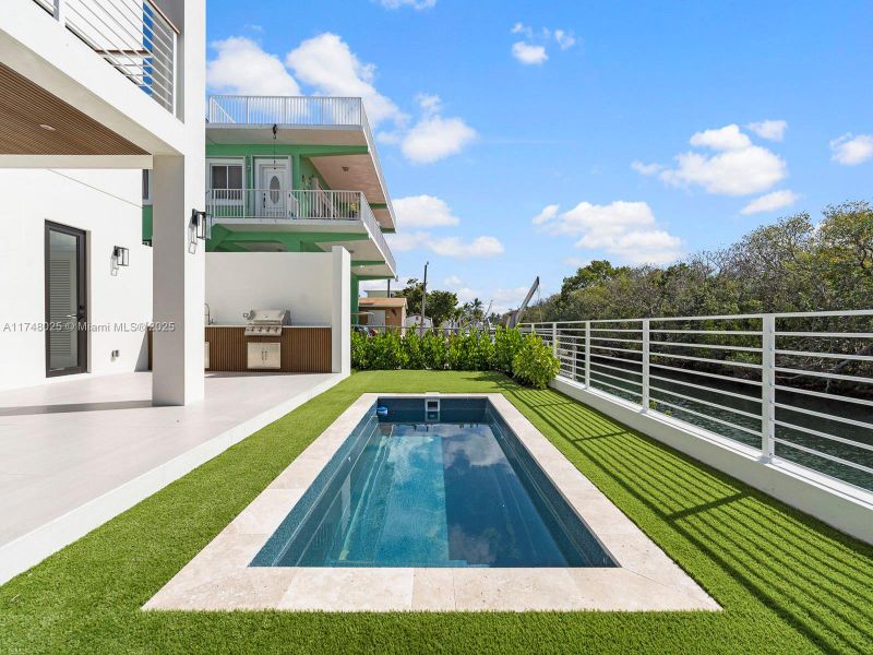 Front exterior of a new home in , Tavernier, FL, highlighting curb appeal (Image 19).