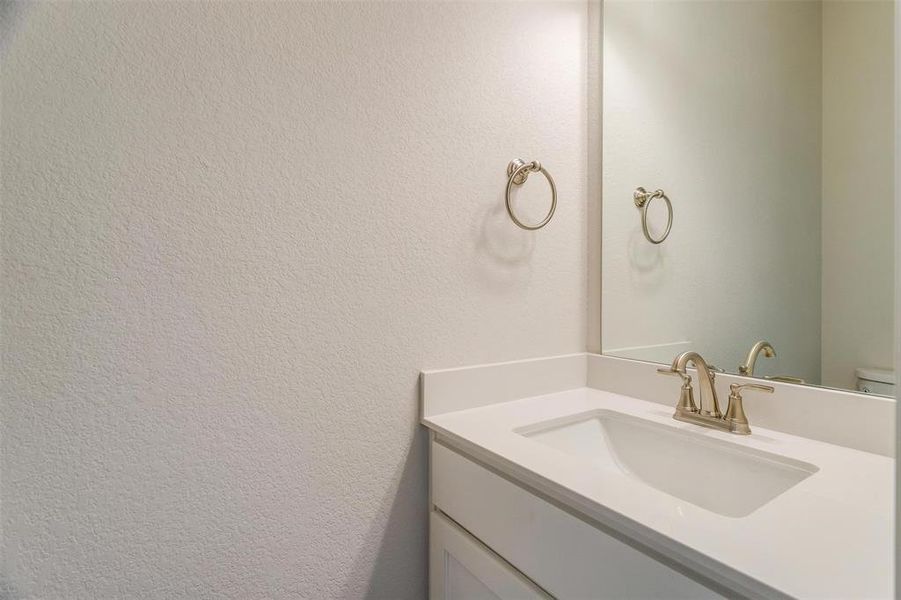 Bathroom with vanity and toilet