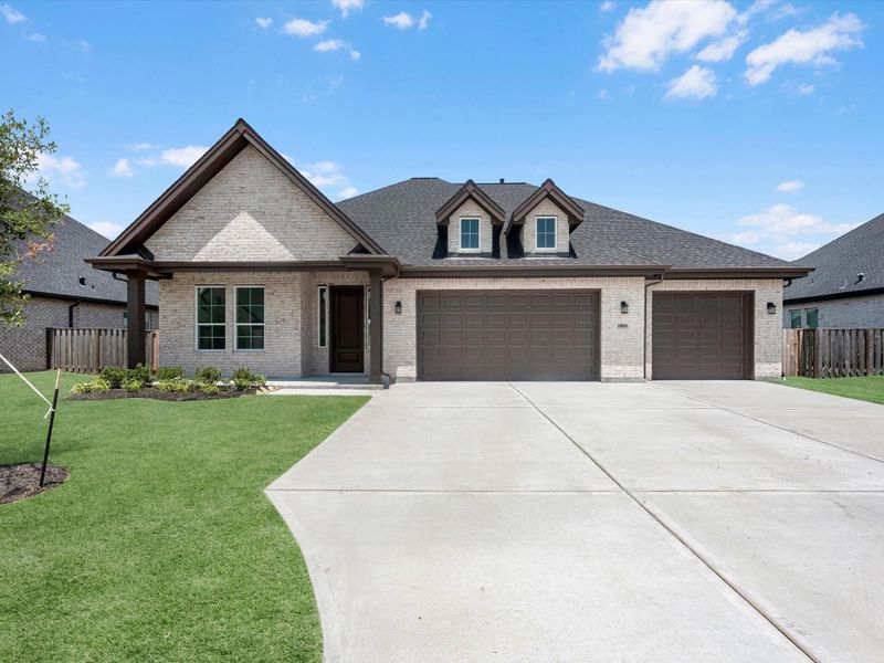 Front exterior of a new home in Blue Heron Estates, Mont Belvieu, TX, highlighting curb appeal (Image 19). Front exterior of a new home in Blue Heron Estates, Mont Belvieu, TX, highlighting curb appeal (Image 19).