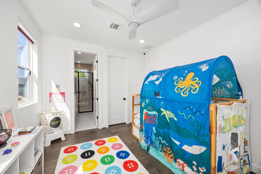 Second bedroom in the main house is ideal for a child’s room, featuring a generous walk-in closet and a private en-suite bathroom