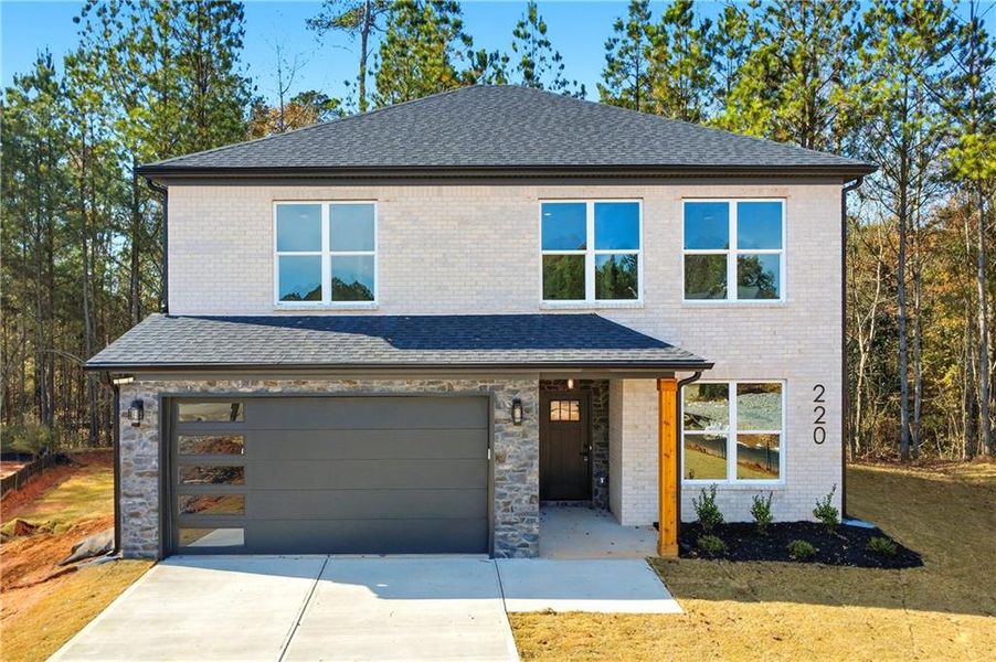 Front exterior of a new home in , Hampton, GA, highlighting curb appeal (Image 2).