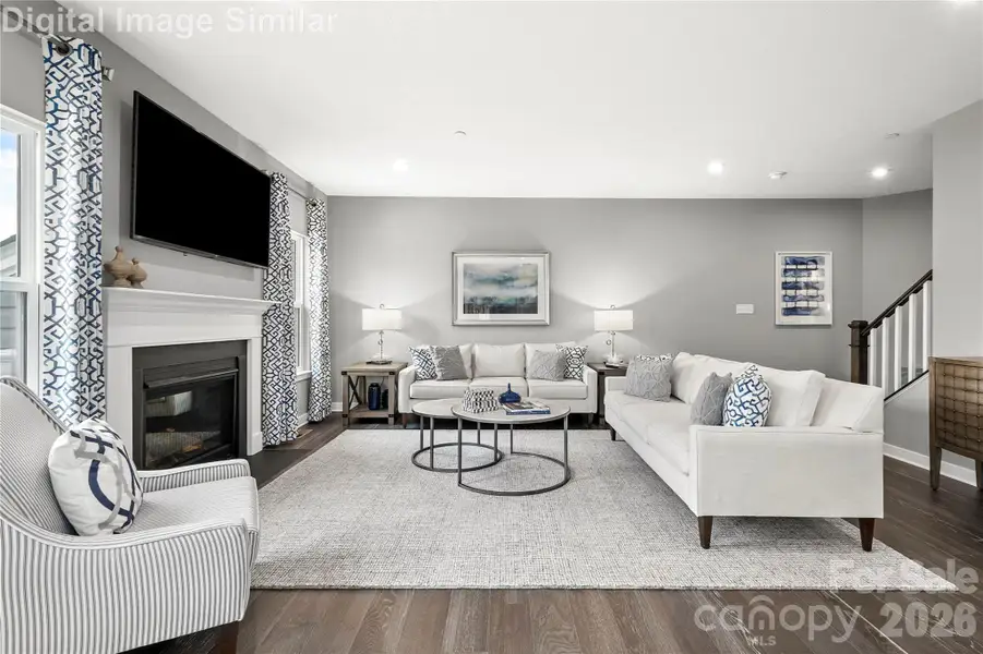 Elegant great room flooded with natural light from two oversized windows, perfect for entertaining or relaxing. Optional fireplace adds warmth and charm to this inviting space. Elegant great room flooded with natural light from two oversized windows, perfect for entertaining or relaxing. Optional fireplace adds warmth and charm to this inviting space.