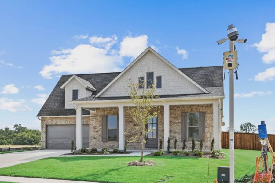 Front exterior of a new home in Chatham Reserve, Providence Village, TX, highlighting curb appeal (Image 1). Front exterior of a new home in Chatham Reserve, Providence Village, TX, highlighting curb appeal (Image 1).
