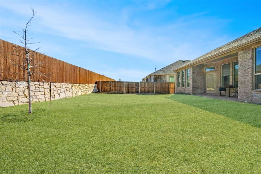 Exterior details and patio area of a home in Northlake Estates, Little Elm (Image 25). Exterior details and patio area of a home in Northlake Estates, Little Elm (Image 25).