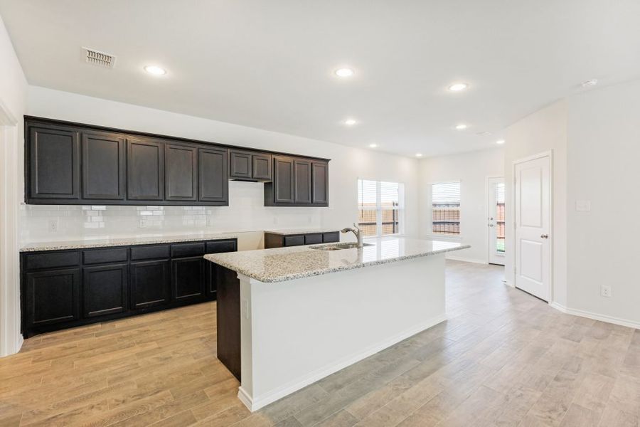 Representative exterior photo of a completed home built from the Lockhart by Impression Homes in Heartland, Heartland, TX (Image 7).