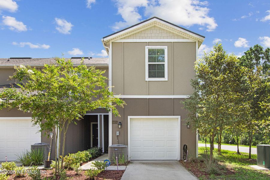 Front exterior of a new home in , Yulee, FL, highlighting curb appeal (Image 2).