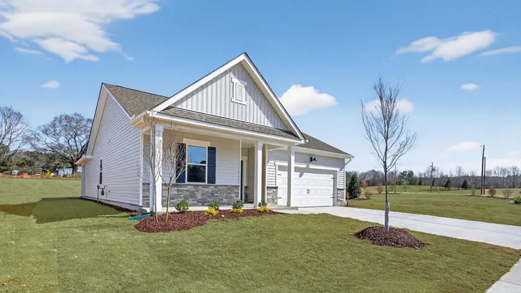 Front exterior of a new home in Tyler - Home on the Lake, New Bern, NC, highlighting curb appeal (Image 2). Front exterior of a new home in Tyler - Home on the Lake, New Bern, NC, highlighting curb appeal (Image 2).