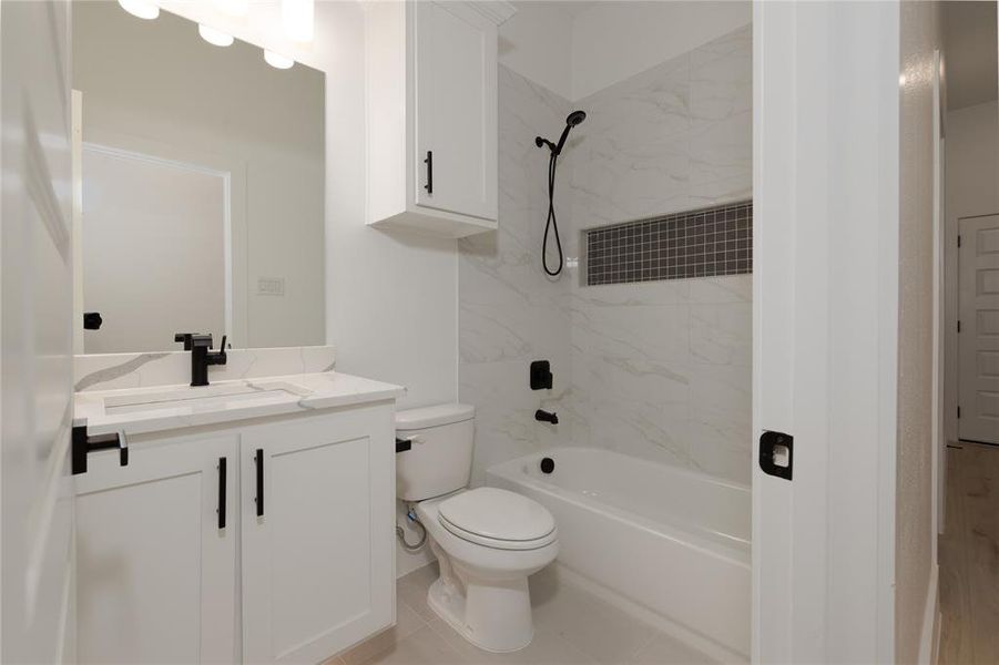 Bathroom with vanity and washtub / shower combination
