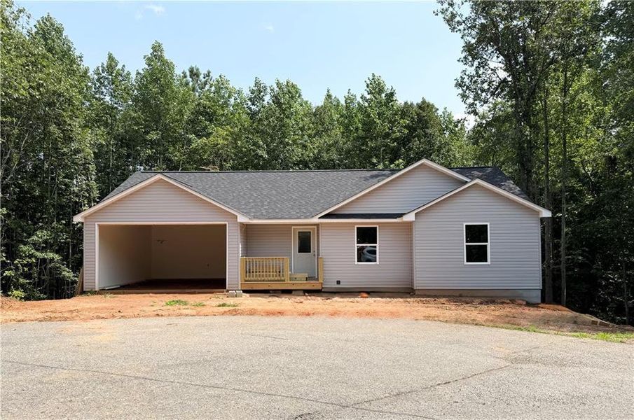 Front exterior of a new home in , Mount Airy, GA, highlighting curb appeal (Image 1). Front exterior of a new home in , Mount Airy, GA, highlighting curb appeal (Image 1).
