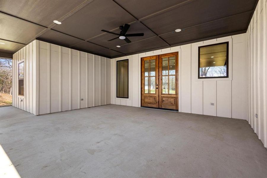 View of patio / terrace with french doors and ceiling fan