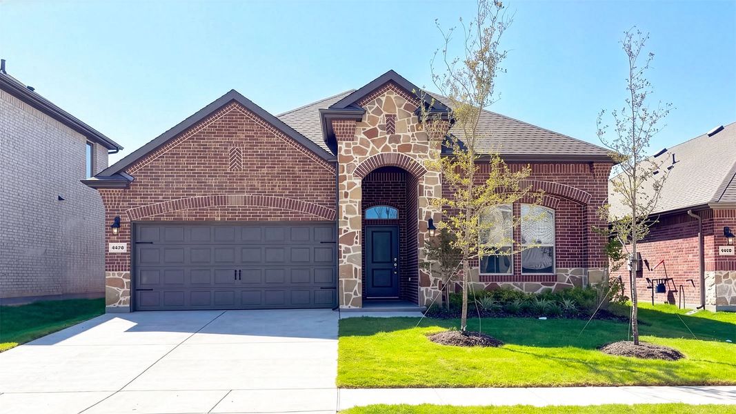 Front exterior of a new home in Lakewood Trails, Forney, TX, highlighting curb appeal (Image 1). Front exterior of a new home in Lakewood Trails, Forney, TX, highlighting curb appeal (Image 1).