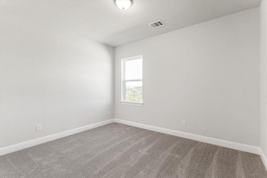 Unfurnished room with carpet floors and baseboards