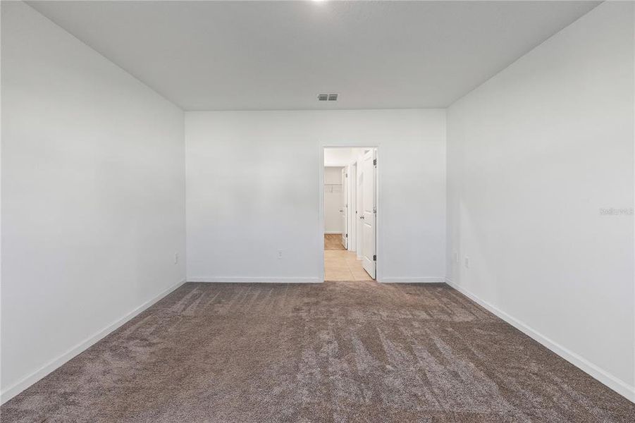 Spacious, unfurnished interior of a new home in Storey Creek: Manor Collection, Kissimmee (Image 27).