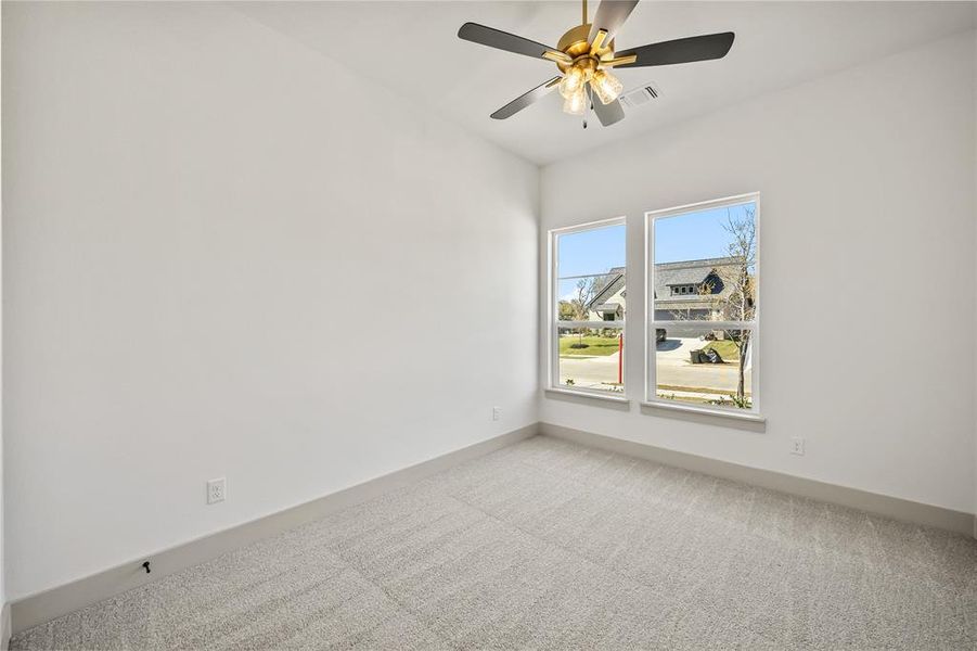 Unfurnished room with carpet floors and ceiling fan