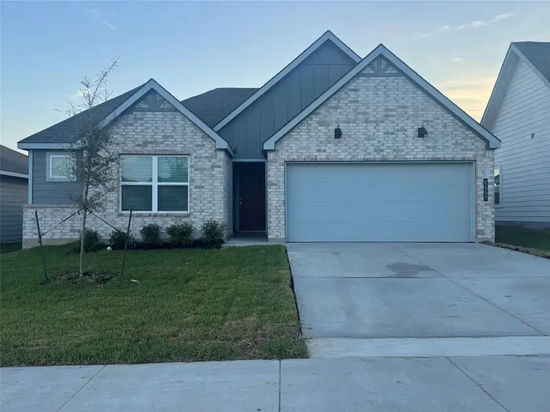 Front exterior of a new home in Pleasant Hill, Bryan, TX, highlighting curb appeal (Image 1). Front exterior of a new home in Pleasant Hill, Bryan, TX, highlighting curb appeal (Image 1).
