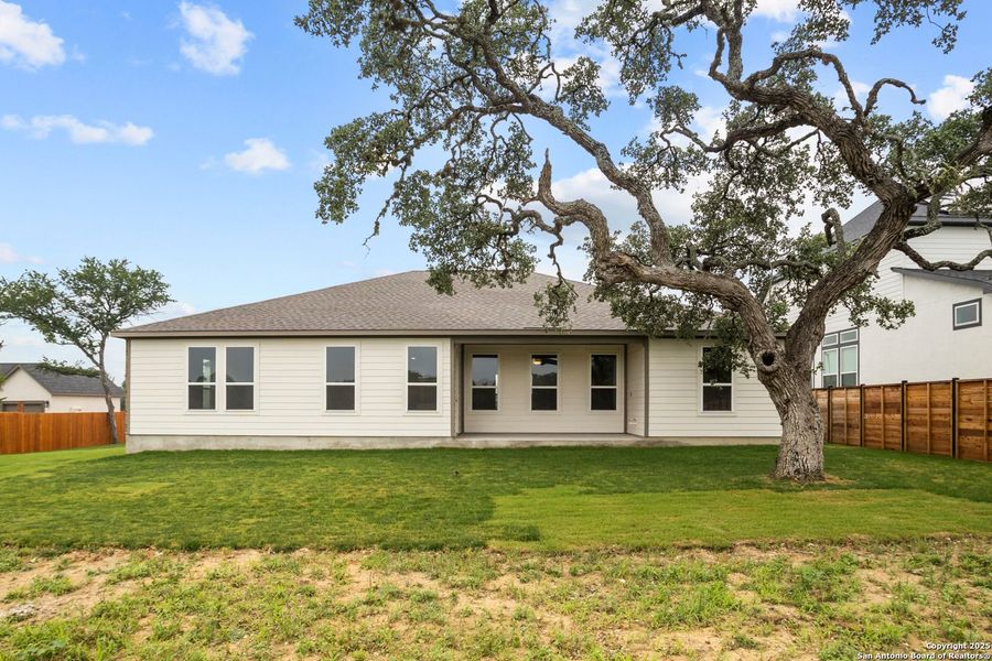 Front exterior of a new home in Potranco Oaks, Castroville, TX, highlighting curb appeal (Image 49).