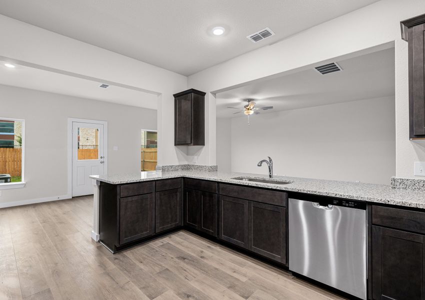 The dining room and living room both sit right off of the kitchen.