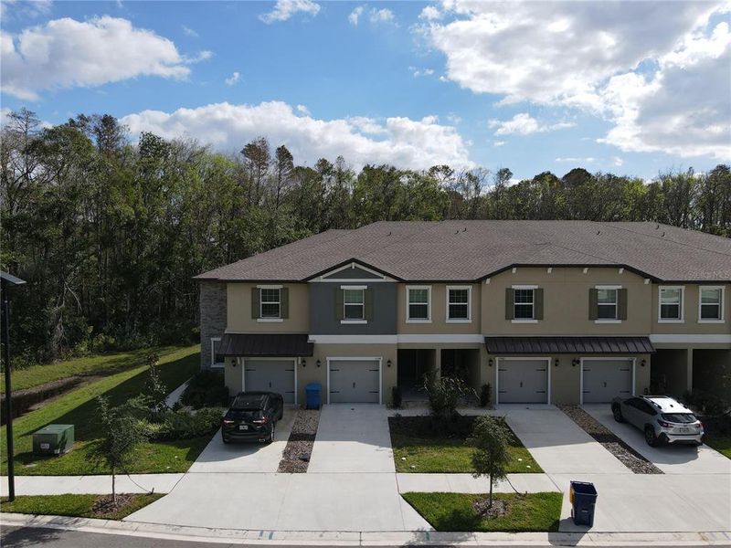 Front exterior of a new home in , Land O' Lakes, FL, highlighting curb appeal (Image 1). Front exterior of a new home in , Land O' Lakes, FL, highlighting curb appeal (Image 1).