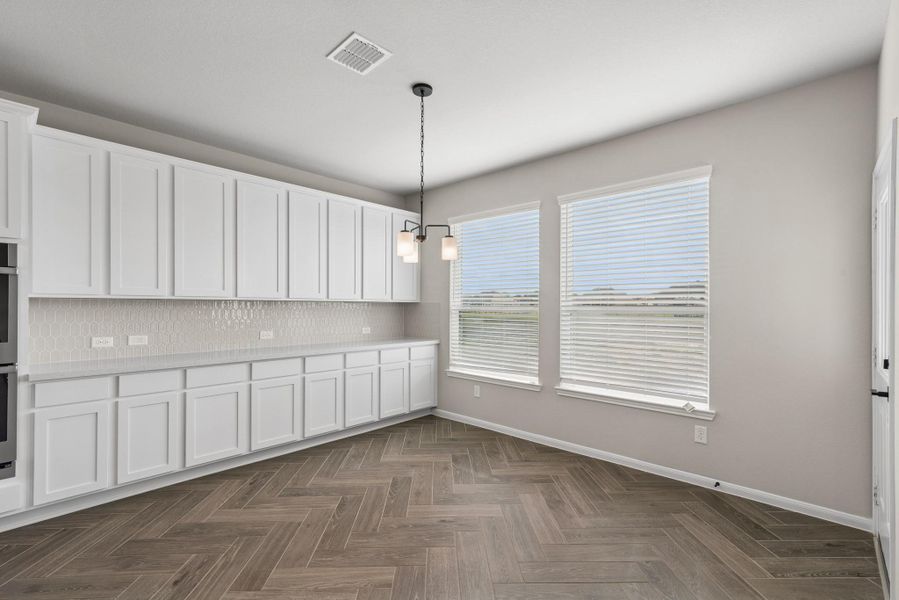 Charming dining area with extra cabinets (*Photo not of actual home and used for illustration purposes only.) Charming dining area with extra cabinets (*Photo not of actual home and used for illustration purposes only.)
