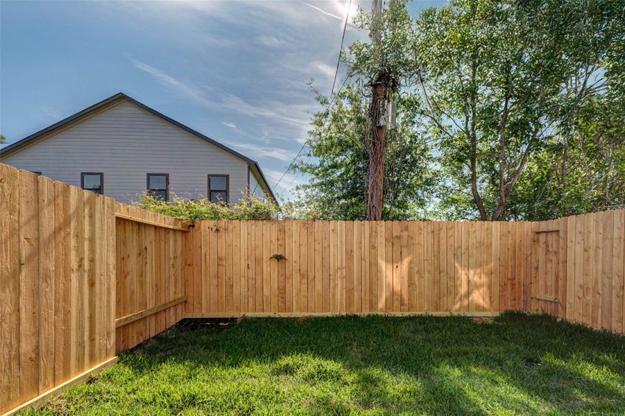 A fully fenced outdoor area offers a secure and low-maintenance retreat at the rear of the home.