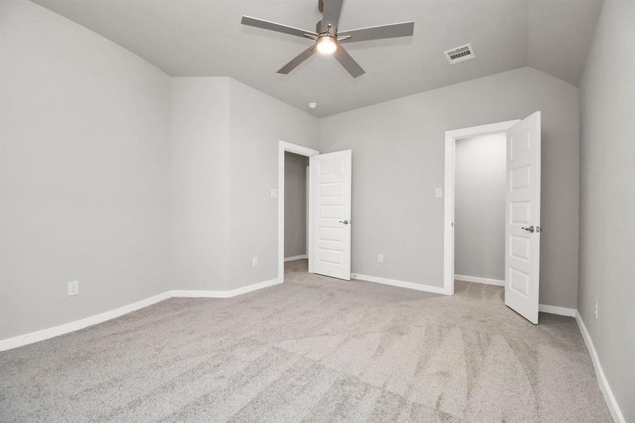 Generously sized secondary bedrooms featuring spacious closets, soft and inviting carpetingunderfoot, large windows allowing plenty of natural light, and the added touch of privacyblinds for your personal retreat. Sample photo of completed home with similar floor plan. Actual colors and selections may vary.