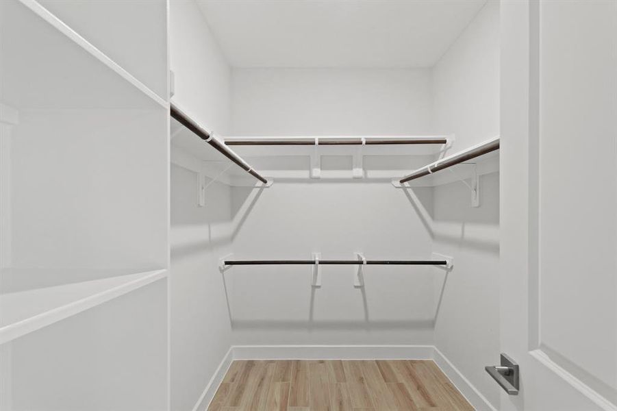 Walk-in closet in primary suite (*Photo not of actual home and used for illustration purposes only.)