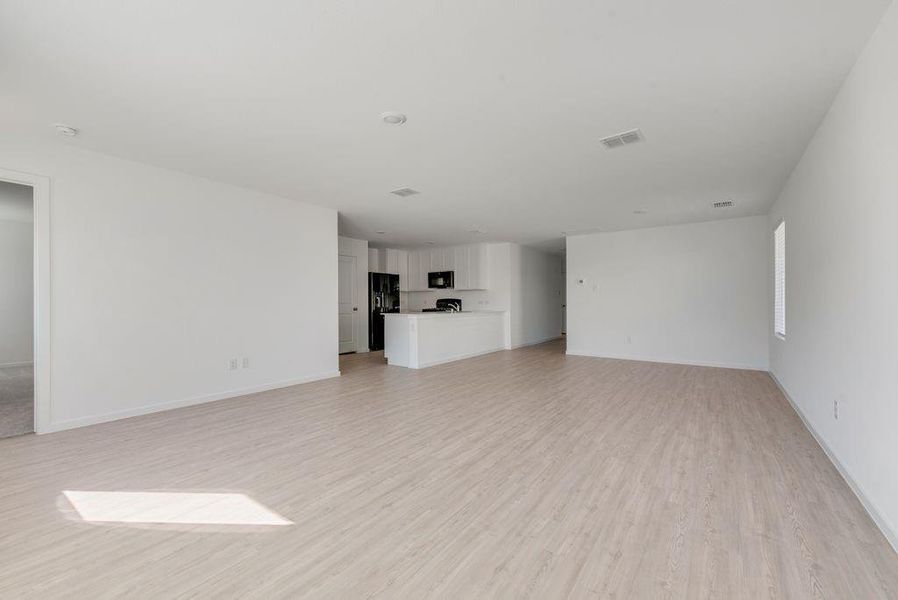 Unfurnished living room with light wood finished floors