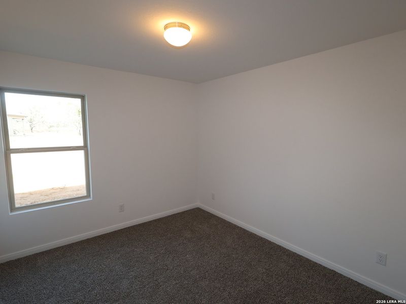 Spacious, unfurnished interior of a new home in Chaparral Ranch, Floresville (Image 24).