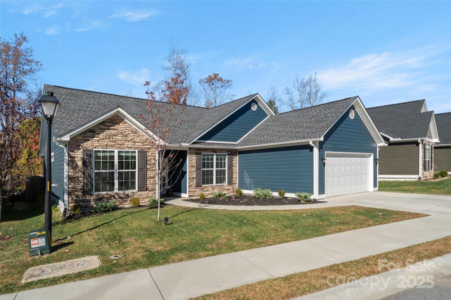 Front exterior of a new home in , Hendersonville, NC, highlighting curb appeal (Image 1). Front exterior of a new home in , Hendersonville, NC, highlighting curb appeal (Image 1).