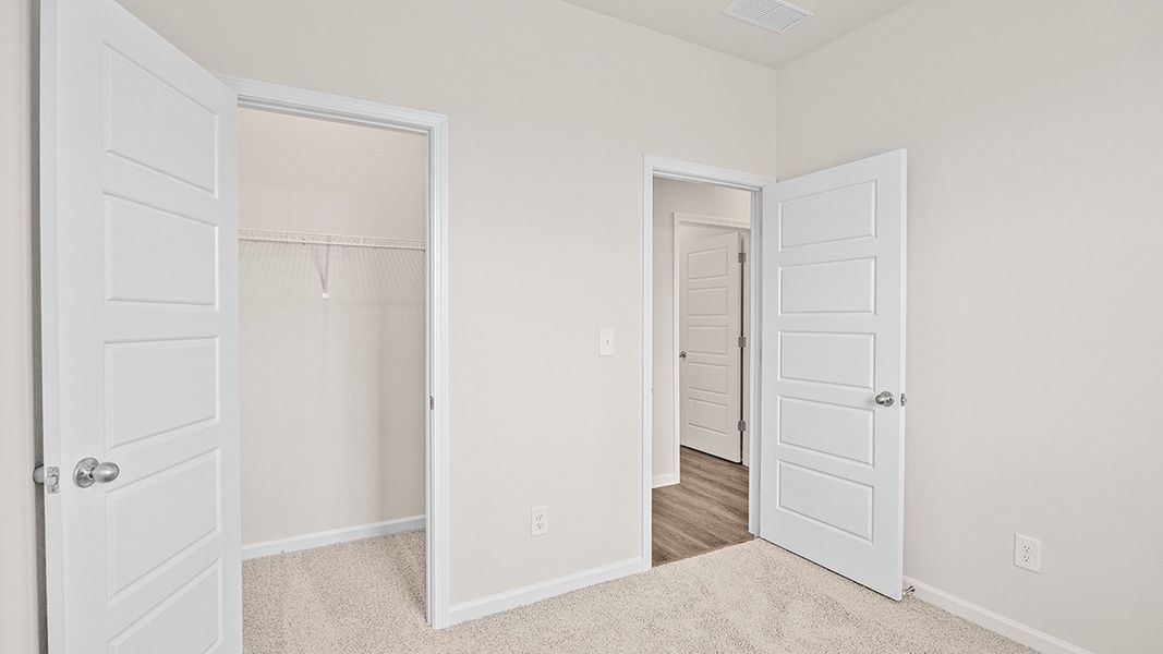 Representative unfurnished interior of a home built from the Edgewood Express - Duplex by D.R. Horton in Remington Chase, Perry (Image 23).