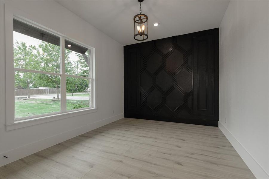 Spare room with light wood-type flooring and recessed lighting