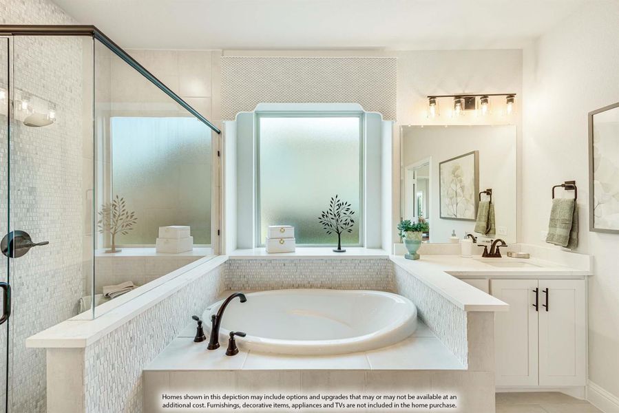Master bathroom with soaking tub, mosaic tile surround, glass shower, and double vanity with white cabinets