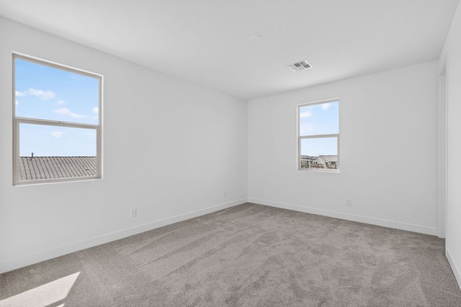 Spacious, unfurnished interior of a new home in Artisan at Asante, Surprise (Image 22).