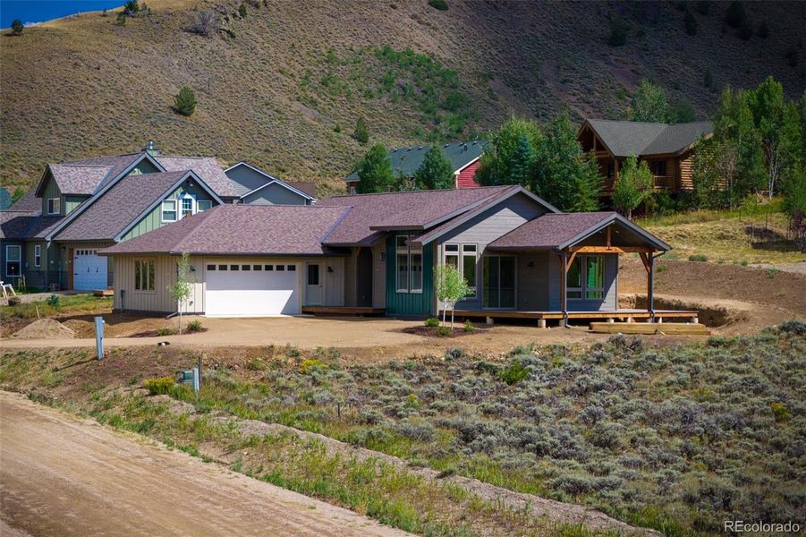 Front exterior of a new home in , Hot Sulphur Springs, CO, highlighting curb appeal (Image 1).