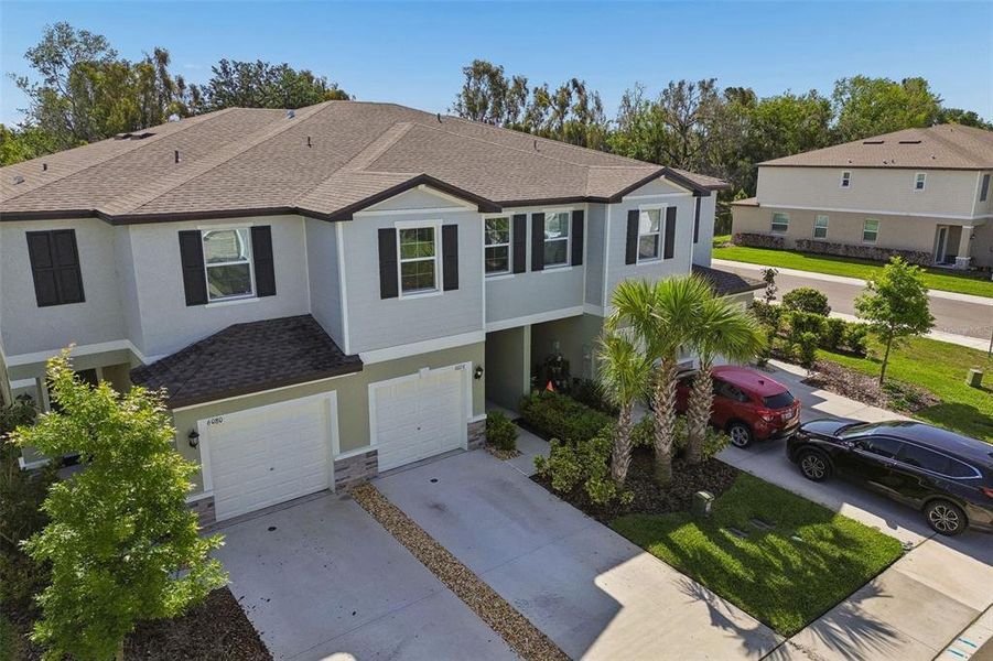 Front exterior of a new home in , Land O' Lakes, FL, highlighting curb appeal (Image 24).