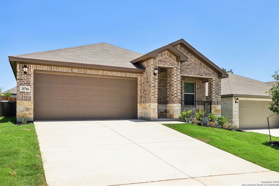 Front exterior of a new home in Scenic Crest - Premier Series, Boerne, TX, highlighting curb appeal (Image 2). Front exterior of a new home in Scenic Crest - Premier Series, Boerne, TX, highlighting curb appeal (Image 2).