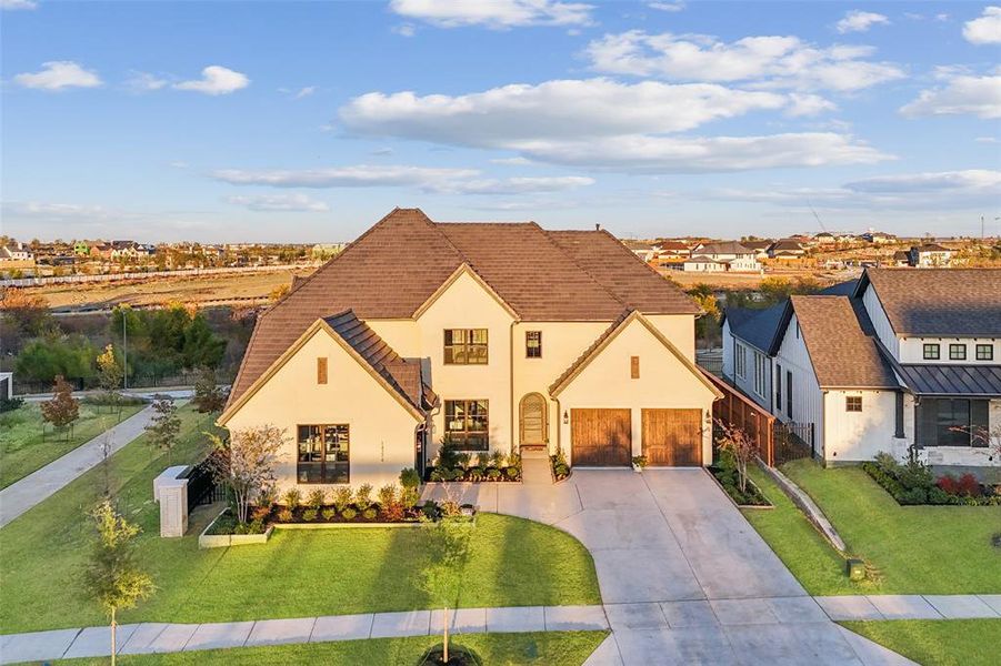 Front exterior of a new home in , Frisco, TX, highlighting curb appeal (Image 23).