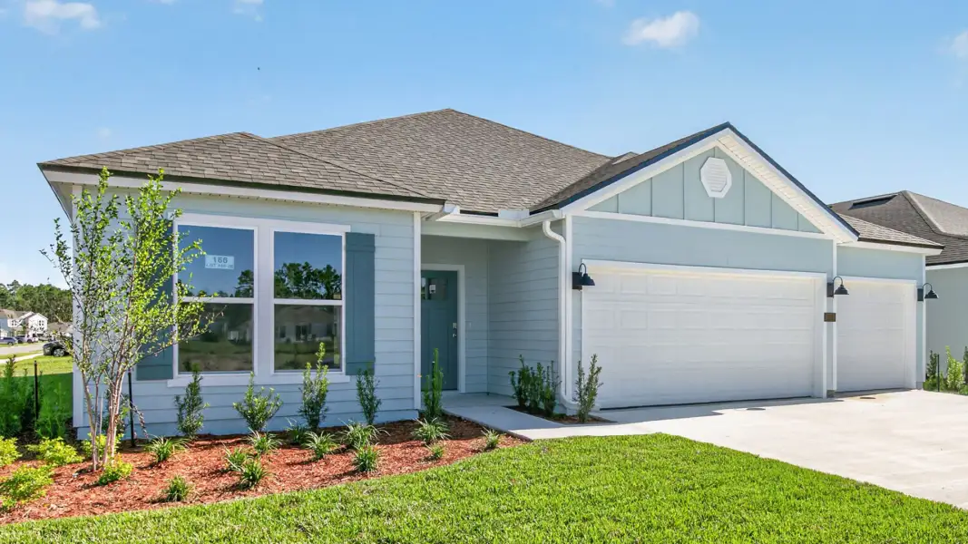 Front exterior of a new home in Sawmill Branch, Palm Coast, FL, highlighting curb appeal (Image 1). Front exterior of a new home in Sawmill Branch, Palm Coast, FL, highlighting curb appeal (Image 1).