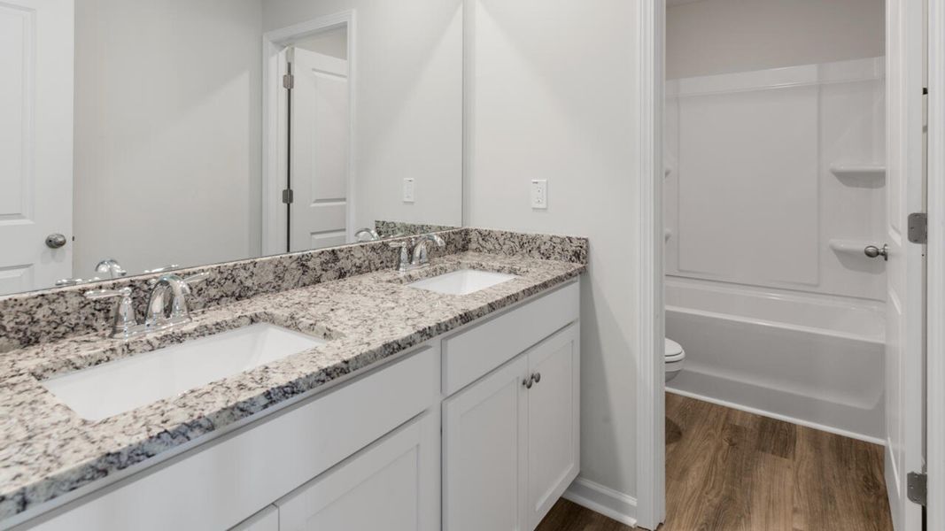 Representative furnished interior of a home built from the HARBOR OAK by D.R. Horton in Indigo Preserve, Leland (Image 15).