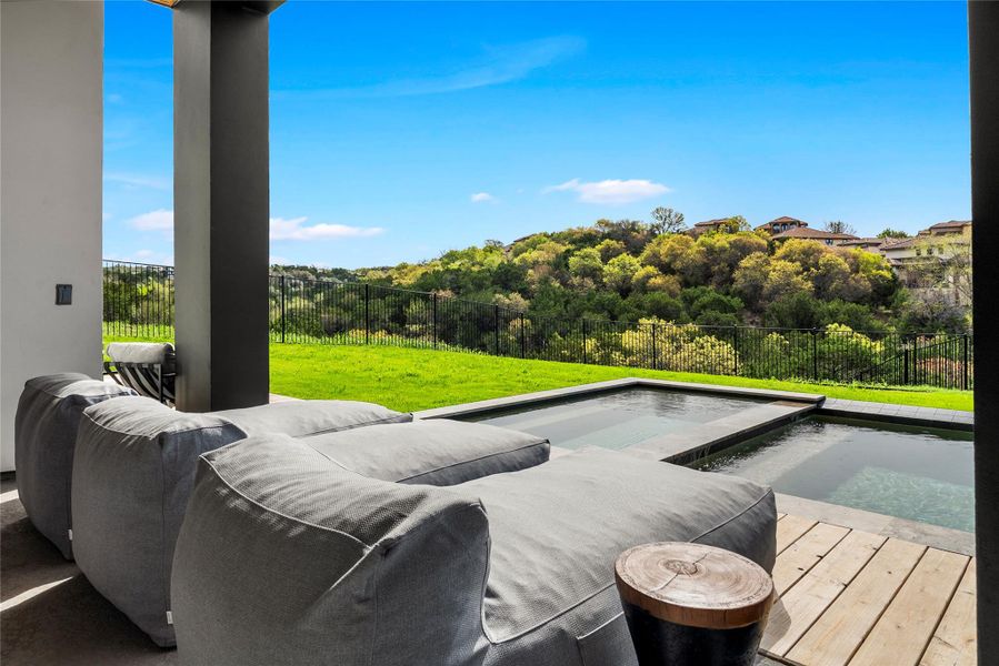 View of pool with a fenced backyard, a swimming pool, and patio surround View of pool with a fenced backyard, a swimming pool, and patio surround